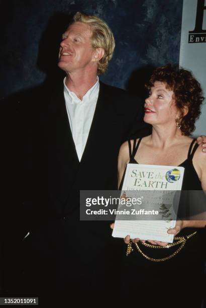 American actor Ed Begley Jr and American actress Marsha Mason, who holds a copy of 'Save the Earth by Jonathan Porritt, attend the 1st Annual...
