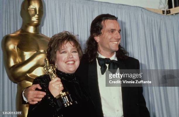 American actress Kathy Bates and British actor Daniel Day-Lewis in the press room of the 63rd Academy Awards, held at the Shrine Auditorium in Los...