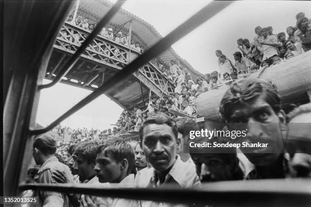 Crowds of people waiting to get a view of the remains of Congress leader Sanjay Gandhi being carried in a special train on way to Prayagraj for...