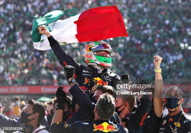 Sergio Perez of Mexico and Red Bull Racing celebrates finishing in third place in parc ferme during the F1 Grand Prix of Mexico at Autodromo Hermanos...