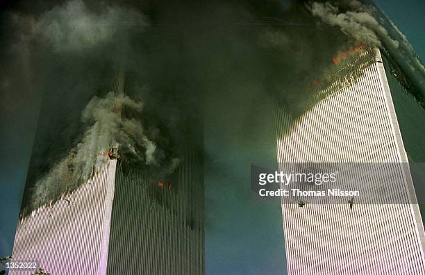 The World Trade Center is engulfed in flames just before the south tower collapsed September 11, 2001 in New York City.