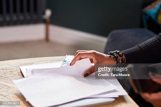 close up of woman's hands holding paper bills. - person holding blank piece of paper stock pictures, royalty-free photos & images