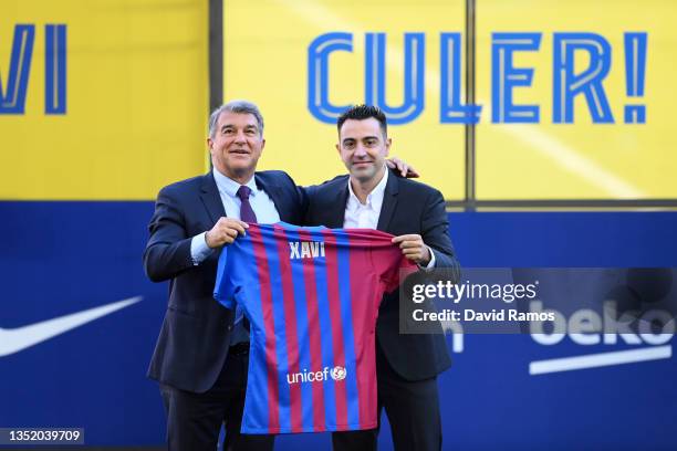 New FC Barcelona Head Coach Xavi Hernandez and Joan Laporta, President of FC Barcelona pose for a photo during a press conference at Camp Nou on...