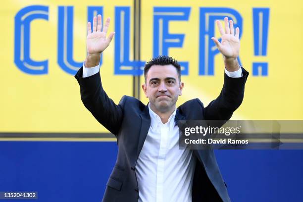 New FC Barcelona Head Coach Xavi Hernandez acknowledges fans during a press conference at Camp Nou on November 08, 2021 in Barcelona, Spain.