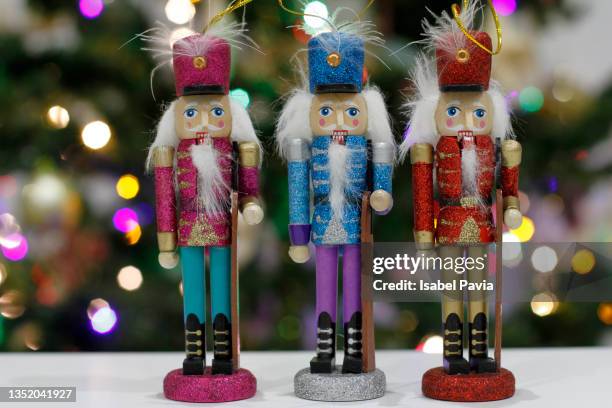 close-up of three nutcrackers in a row - nutcracker stock pictures, royalty-free photos & images