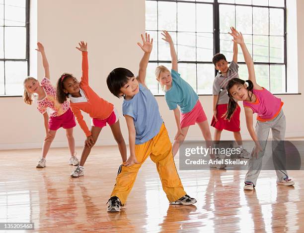 children exercising in fitness class - daily sport girls bildbanksfoton och bilder