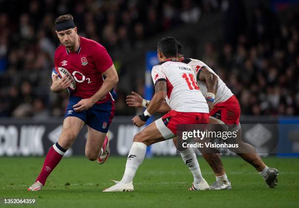 Mark Atkinson of England runs at the Tonga defence during the Quilter Autumn Nations Series match between England and Tonga at Twickenham Stadium on...