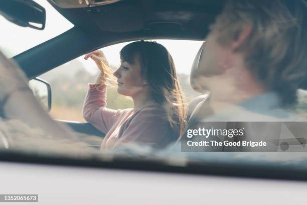 girlfriend and boyfriend in car during road trip - journey pov stock pictures, royalty-free photos & images