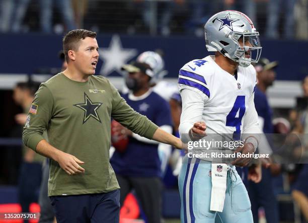 Dallas Cowboys offensive coordinator Kellen Moore and quarterback Dak Prescott on the field during warmups before the game against the Denver Broncos...