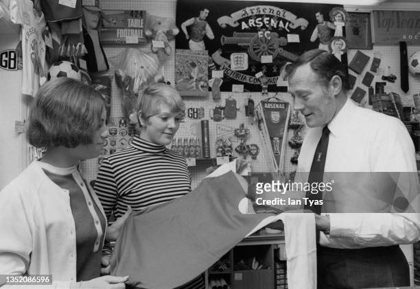 Jack Kelsey from Wales and former Goalkeeper and commercial manager for Arsenal Football Club at work in the club souvenir shop circa August 1971 at...