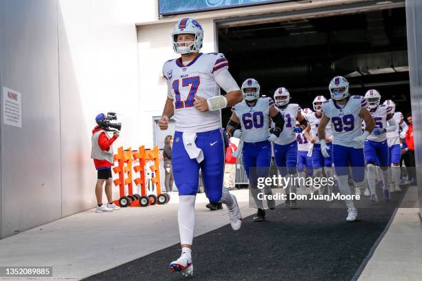 Quarterback Josh Allen of the Buffalo Bills leads his team to the field before the start of the game against the Jacksonville Jaguars at TIAA Bank...