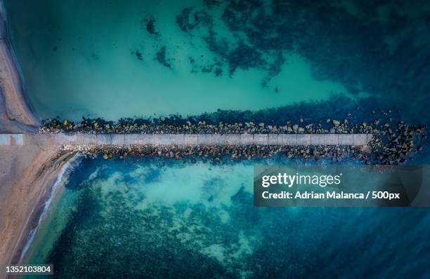 aerial view of pier over sea,eforie sud,romania - romania beach stock pictures, royalty-free photos & images