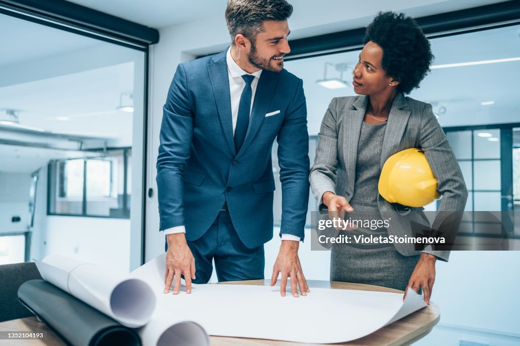 Two architects discussing new project.