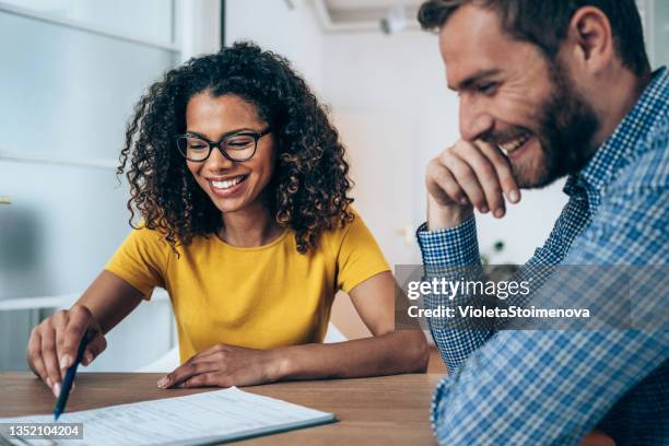 business people signing a contract. - sales meeting stock pictures, royalty-free photos & images