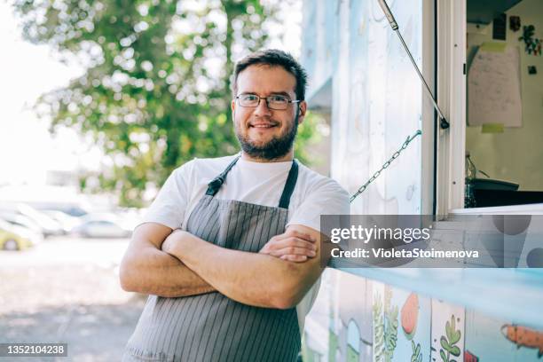 happy young food truck owner. - leaning on elbows stock pictures, royalty-free photos & images