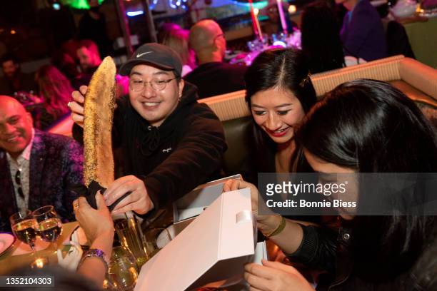Pat Nguyen, Amy Soon and Anh Tran enjoy a multi.sensory meal Emilie Baltz during The Stranger Party by META / Unreality on November 03, 2021 in New...
