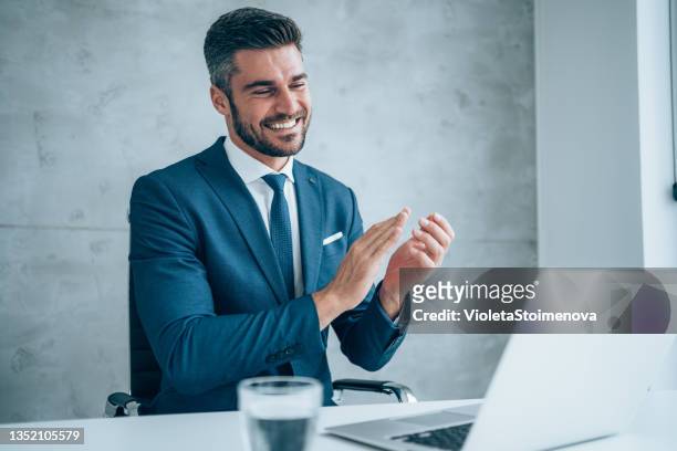 businessman having video call in the office. - businessman applauding stock pictures, royalty-free photos & images