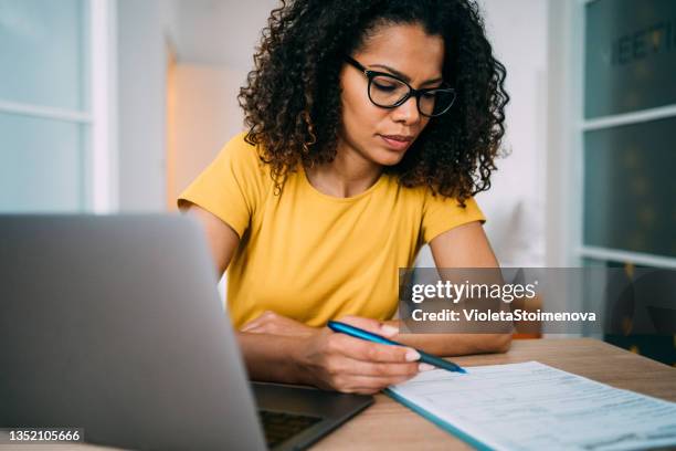 businesswoman working in the office. - business checklist stock pictures, royalty-free photos & images