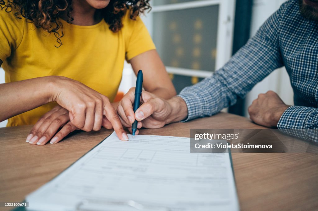Business people signing a contract.