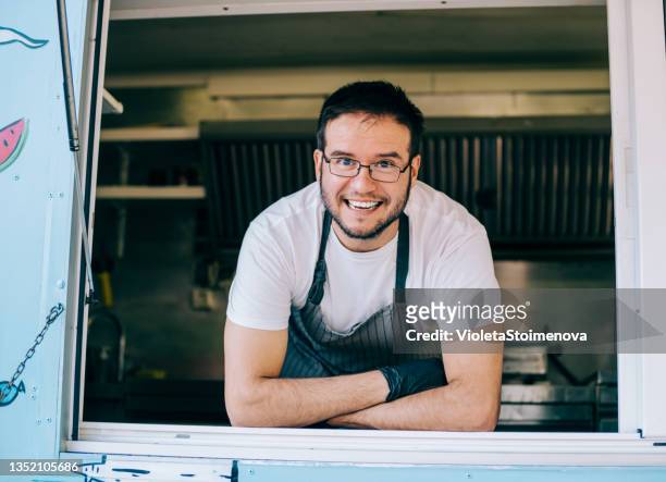happy young food truck owner. - food truck festival stock pictures, royalty-free photos & images