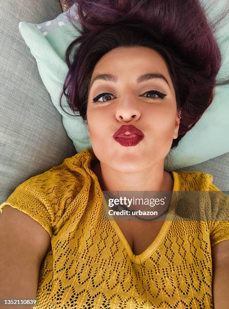 beautiful young woman puckering for selfie - pouting stock pictures, royalty-free photos & images