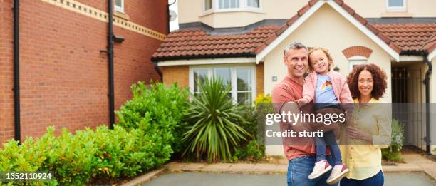 happy family portrait outside home - house of families stock pictures, royalty-free photos & images