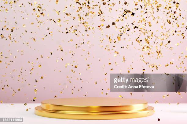 two-tier round gold metal podium on pastel pink background with many falling gold confetti. perfect platform for showing your products. three dimensional illustration - sports round stock-fotos und bilder