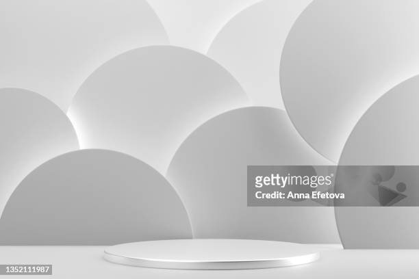 round silver metal podium on abstract white background of many white circles with white backlighting. perfect platform for showing your products. three dimensional illustration - sports round stock-fotos und bilder