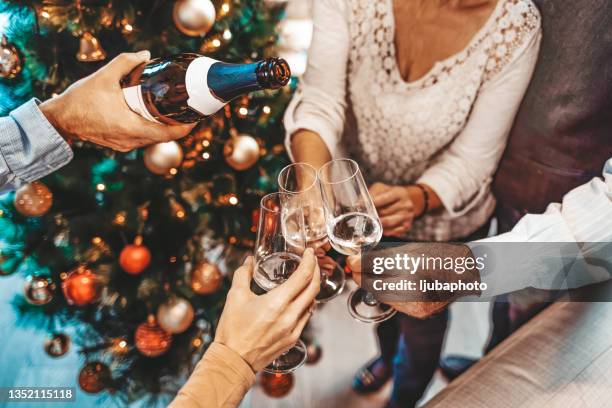 toasting for the arrive of the new year - 75 year old pensioners stockfoto's en -beelden