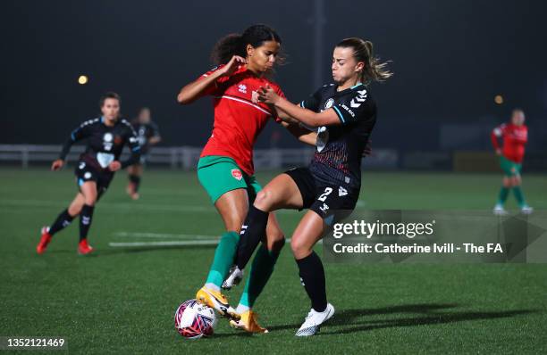 Destiney Toussaint of Coventry United battles for possession with Ella Powell of Bristol City during the FA Women's Championship match between...
