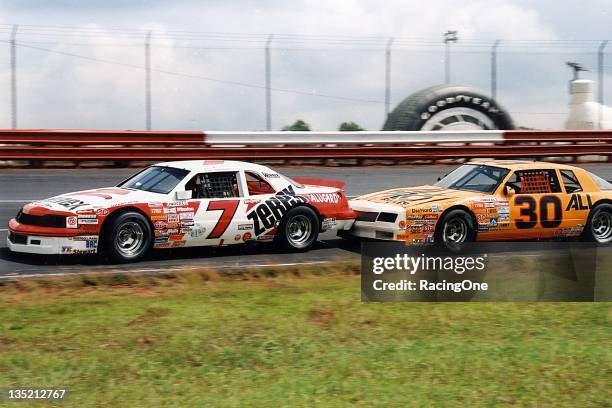 Alan Kulwicki leads Michael Waltrip in the Wrangler Jeans Indigo 400 at Richmond Fairgrounds Raceway. The pair finished 23rd and 19th, respectively.