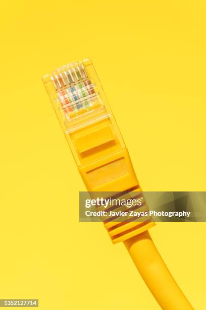 yellow ethernet cable on yellow - yellow ethernet cable stock pictures, royalty-free photos & images