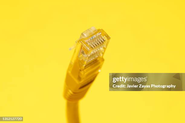 yellow ethernet cable on yellow - yellow ethernet cable stock pictures, royalty-free photos & images