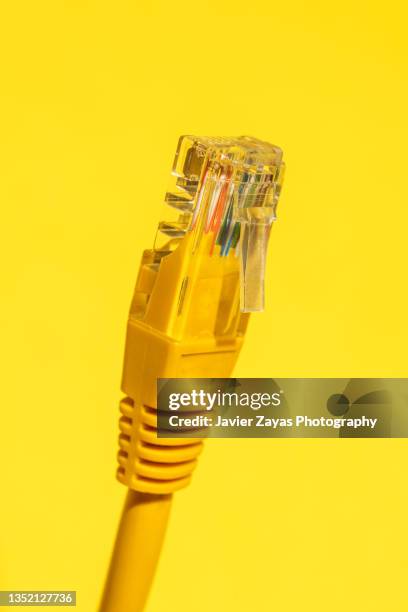 yellow ethernet cable on yellow - yellow ethernet cable stock pictures, royalty-free photos & images