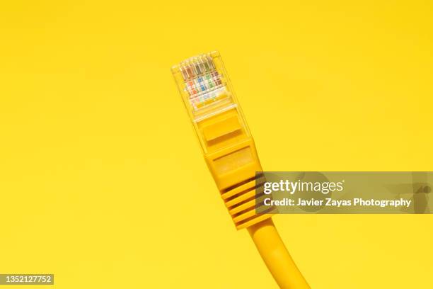 yellow ethernet cable on yellow - yellow ethernet cable stock pictures, royalty-free photos & images