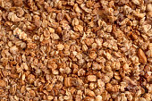 Texture of organic homemade baked granola with oats and nuts