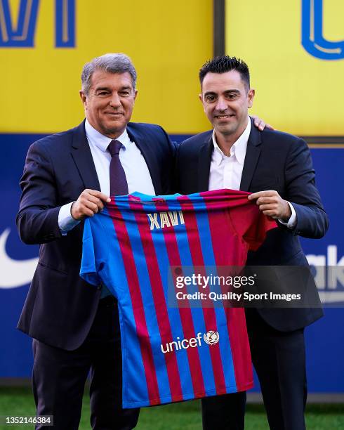 New FC Barcelona Head Coach Xavi Hernandez and Joan Laporta, President of FC Barcelona pose for a photo during a press conference at Camp Nou on...