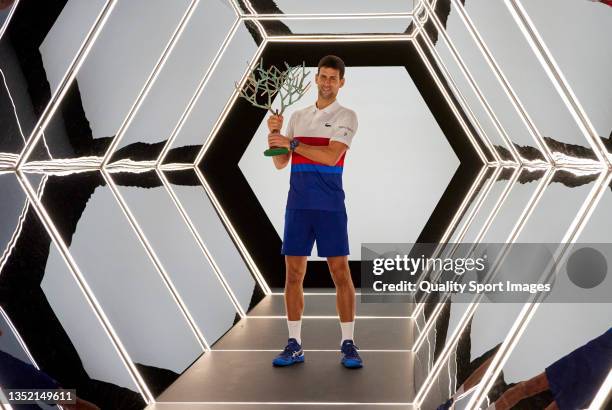 Novak Djokovic of Serbia poses with the trophy after winning the Men's Single's final match against Daniil Medvedev of Russia on Day Seven of the...