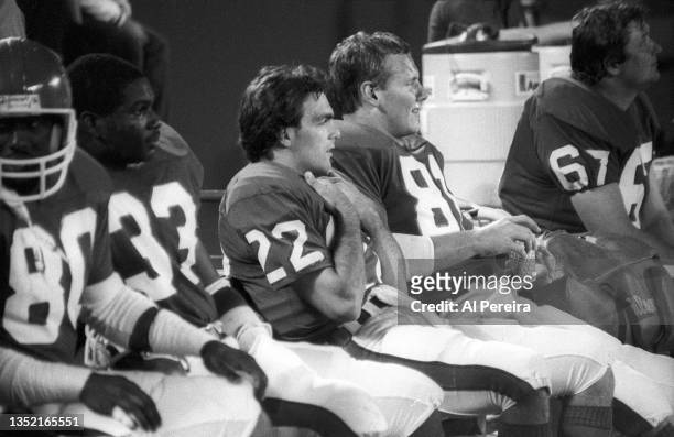 Quarterback Doug Flutie of the New Jersey Generals follows the action from the bench in the game between the Orlando Renegades vs The New Jersey...