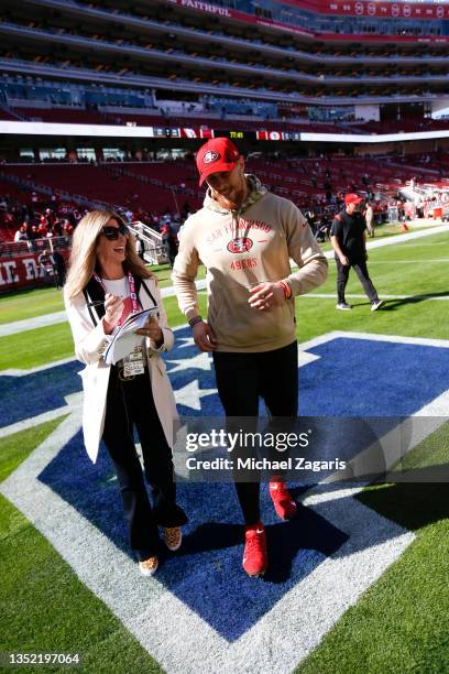 Laura Okmin of Fox Sports interviews George Kittle of the San Francisco 49ers on the field before the game between the 49ers and the Arizona...