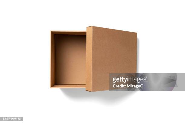 half opened empty cardboard box isolated on white - half open stock pictures, royalty-free photos & images