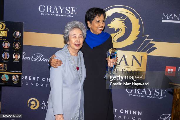 Karen Wong and Indra Nooyi attend the Asian Hall of Fame induction reception at Ben Bridge Jeweler on November 08, 2021 in Seattle, Washington.