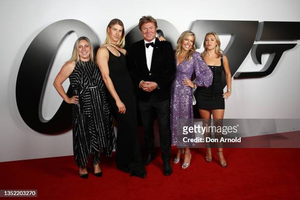 Christian Wilkins, Richard Wilkins and Nicola Dale pose alongside other family members during the premiere of "No Time To Die" at Hoyts Entertainment...