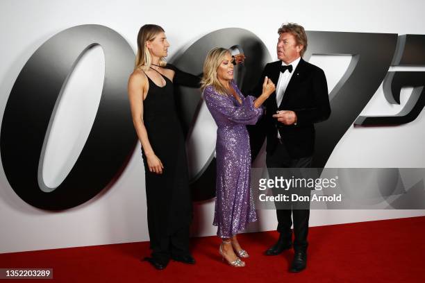 Christian Wilkins, Richard Wilkins and Nicola Dale pose during the premiere of "No Time To Die" at Hoyts Entertainment Quarter on November 09, 2021...