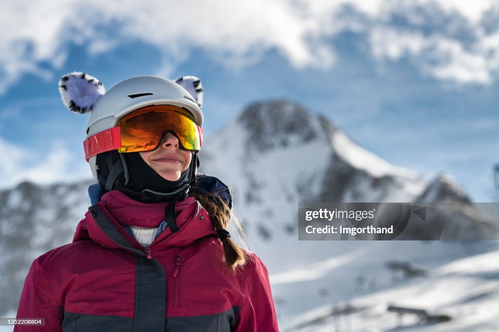 Portrait of a teenage girl enjoying skiing on glacier in the European Alps