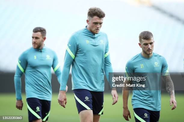 Harry Souttar and Riley Mcgree look on during a Socceroos training session at Stadium Australia on November 09, 2021 in Sydney, Australia.