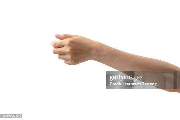 female holding something on white background, closeup of hand - afferrare foto e immagini stock