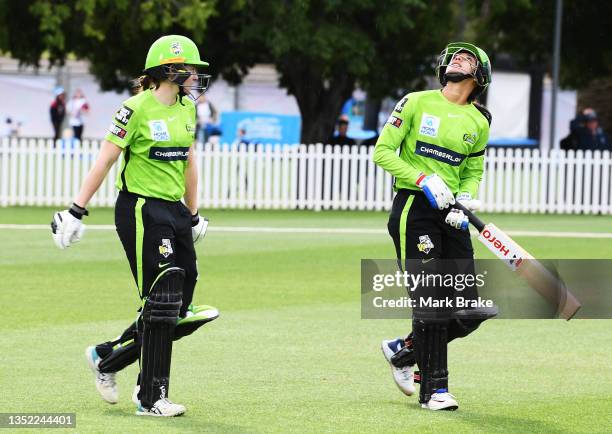 Tahlia Wilson of the Sydney Thunder and Smriti Mandhana of the Sydney Thunder head out to open the batting during the Women's Big Bash League match...