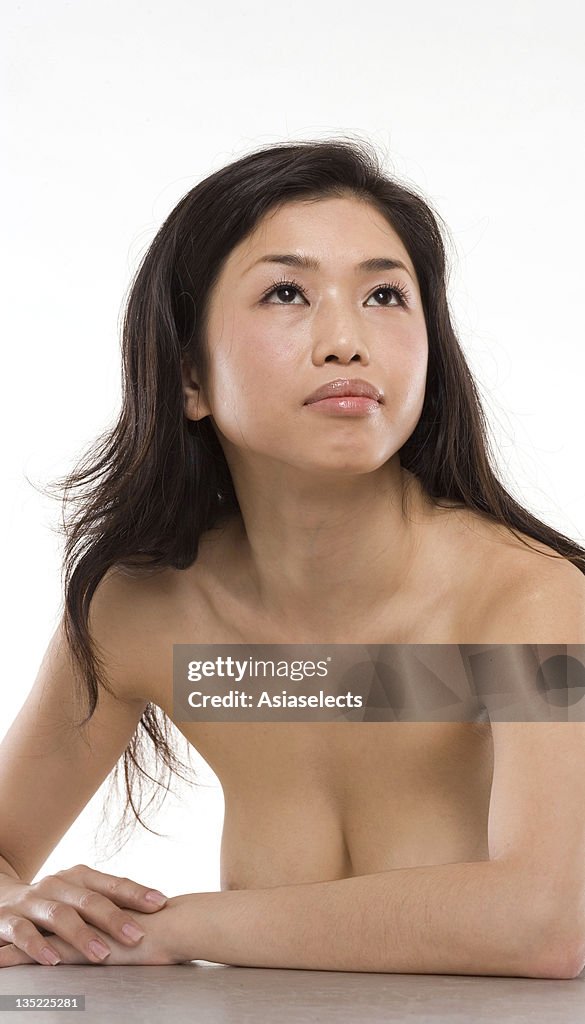 Close-up of a mid adult woman looking up