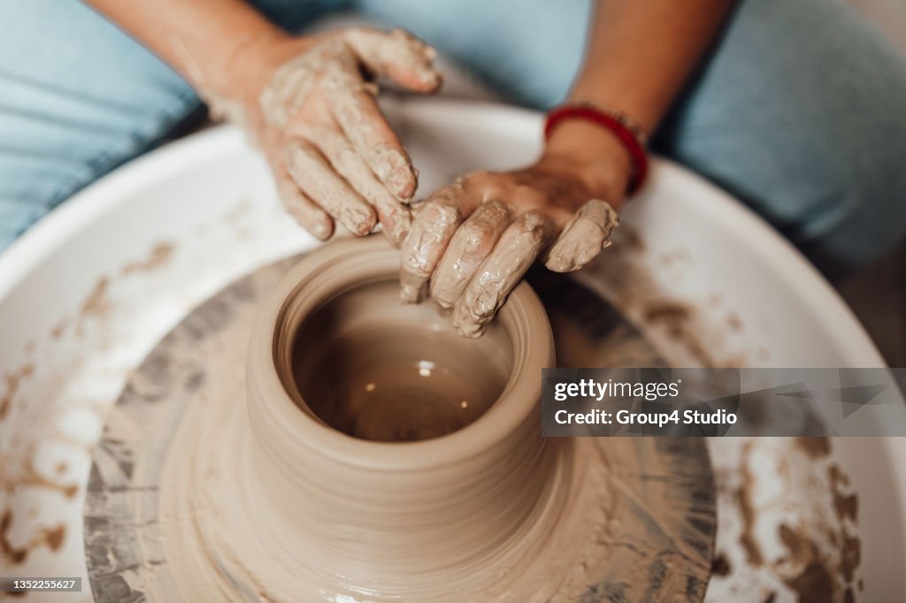 Female potter hands close up